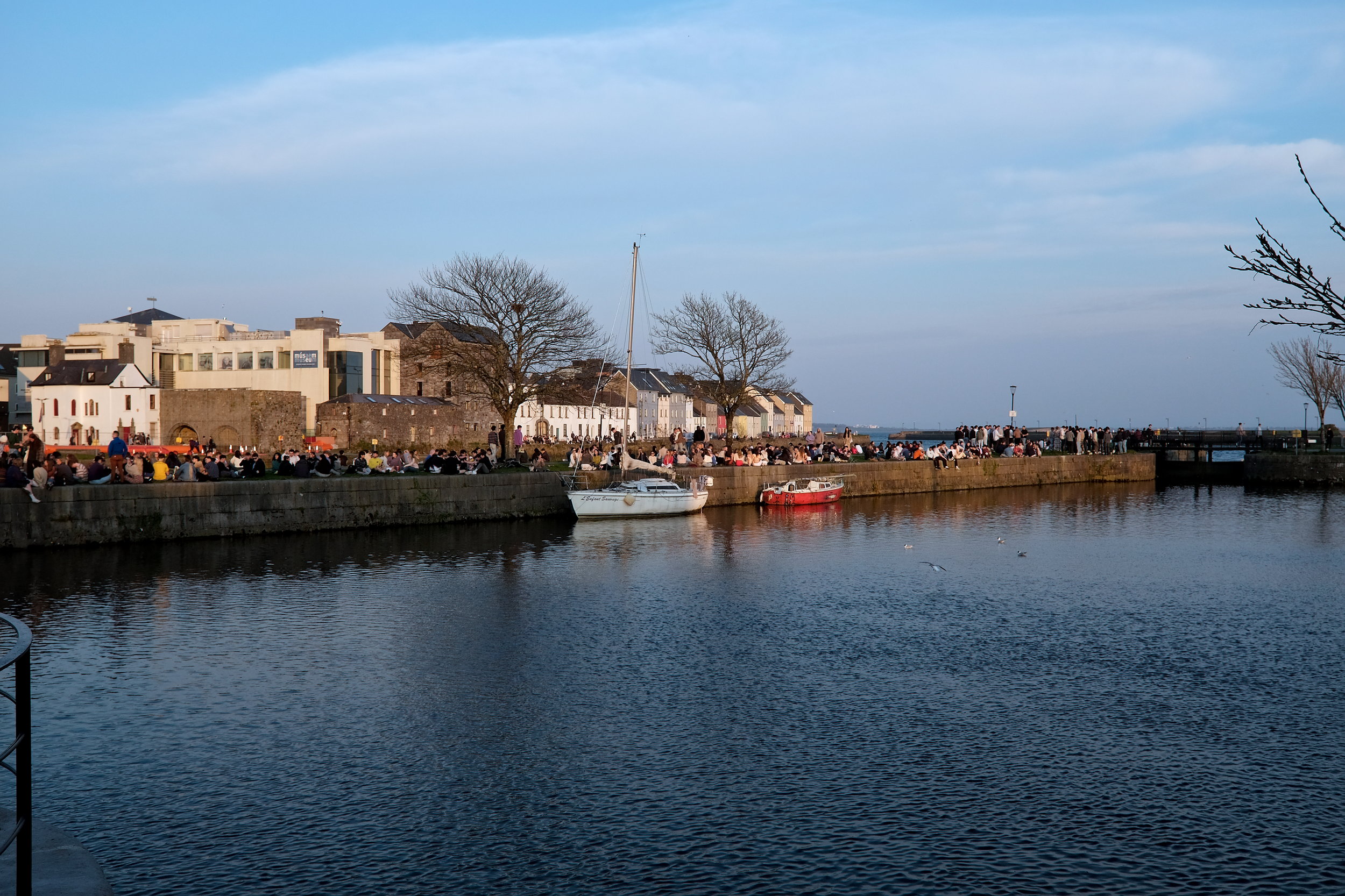 People gather to drink and relax at Claddagh Basin