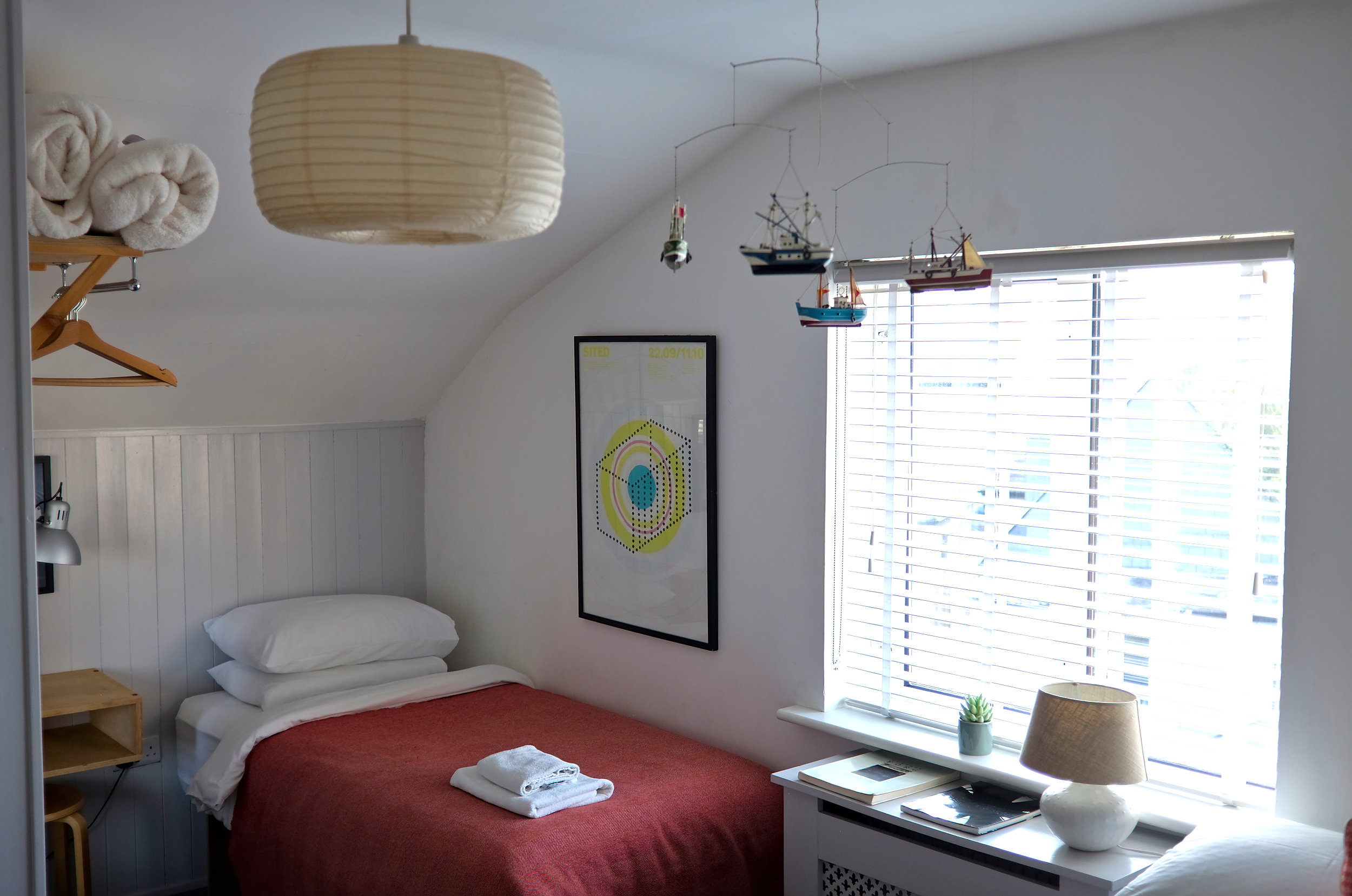 A cozy bedroom at The Stop B&B