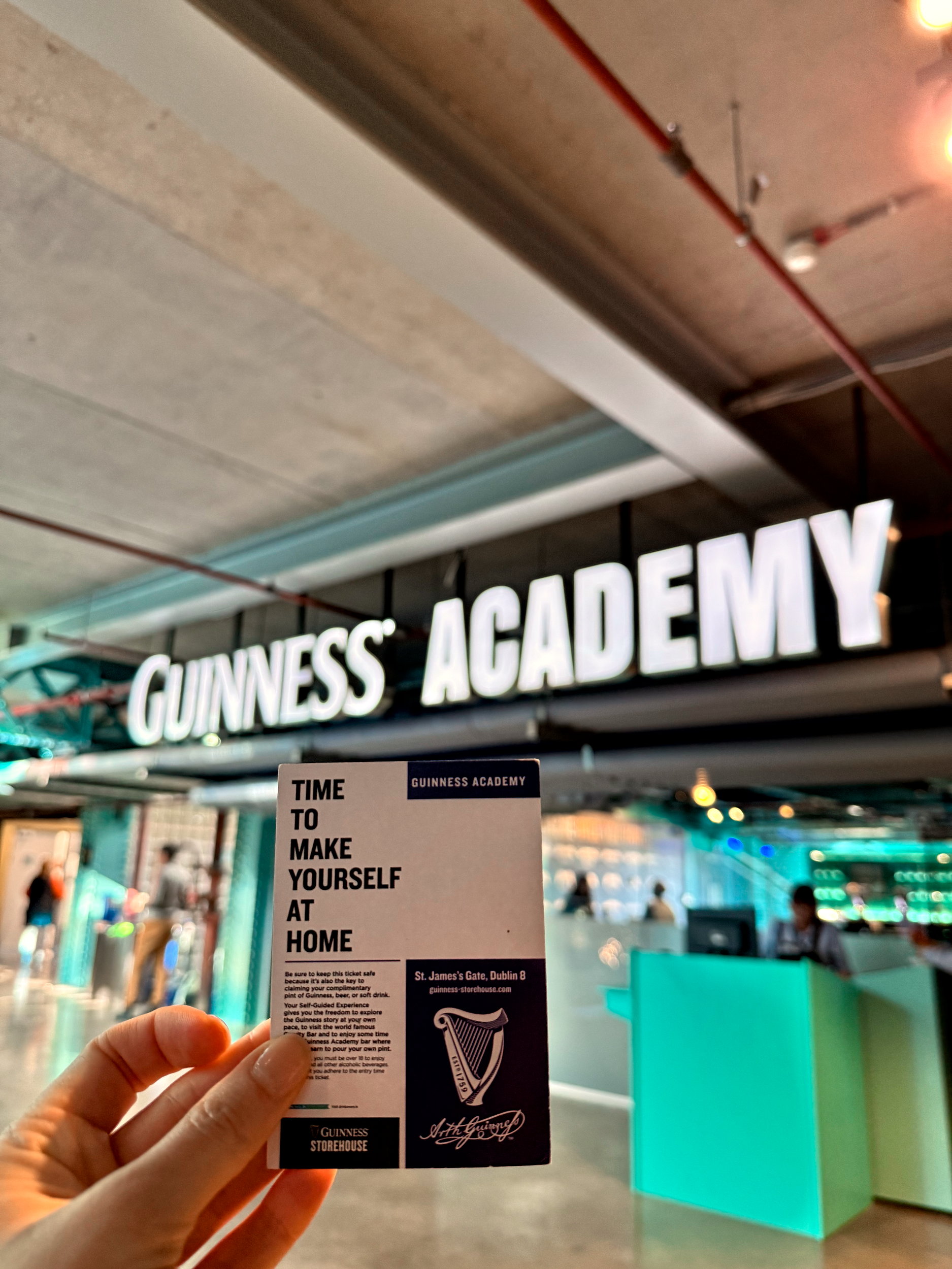 Alyssa holds a ticket up at the Guinness Academy