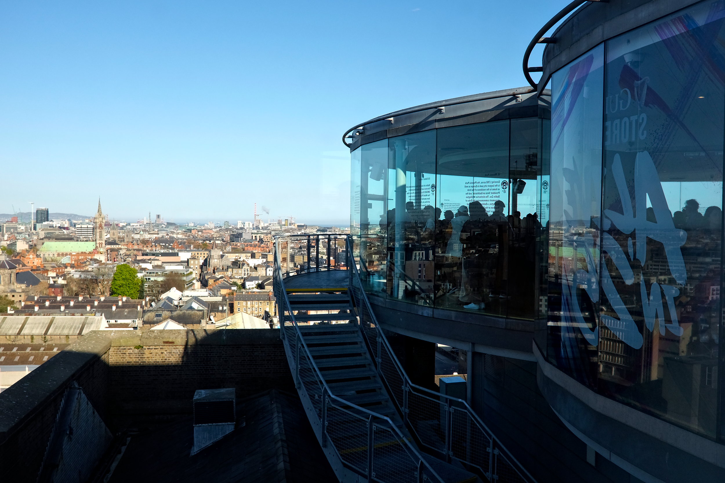 A crowd inside the Gravity Bar, seen through a window