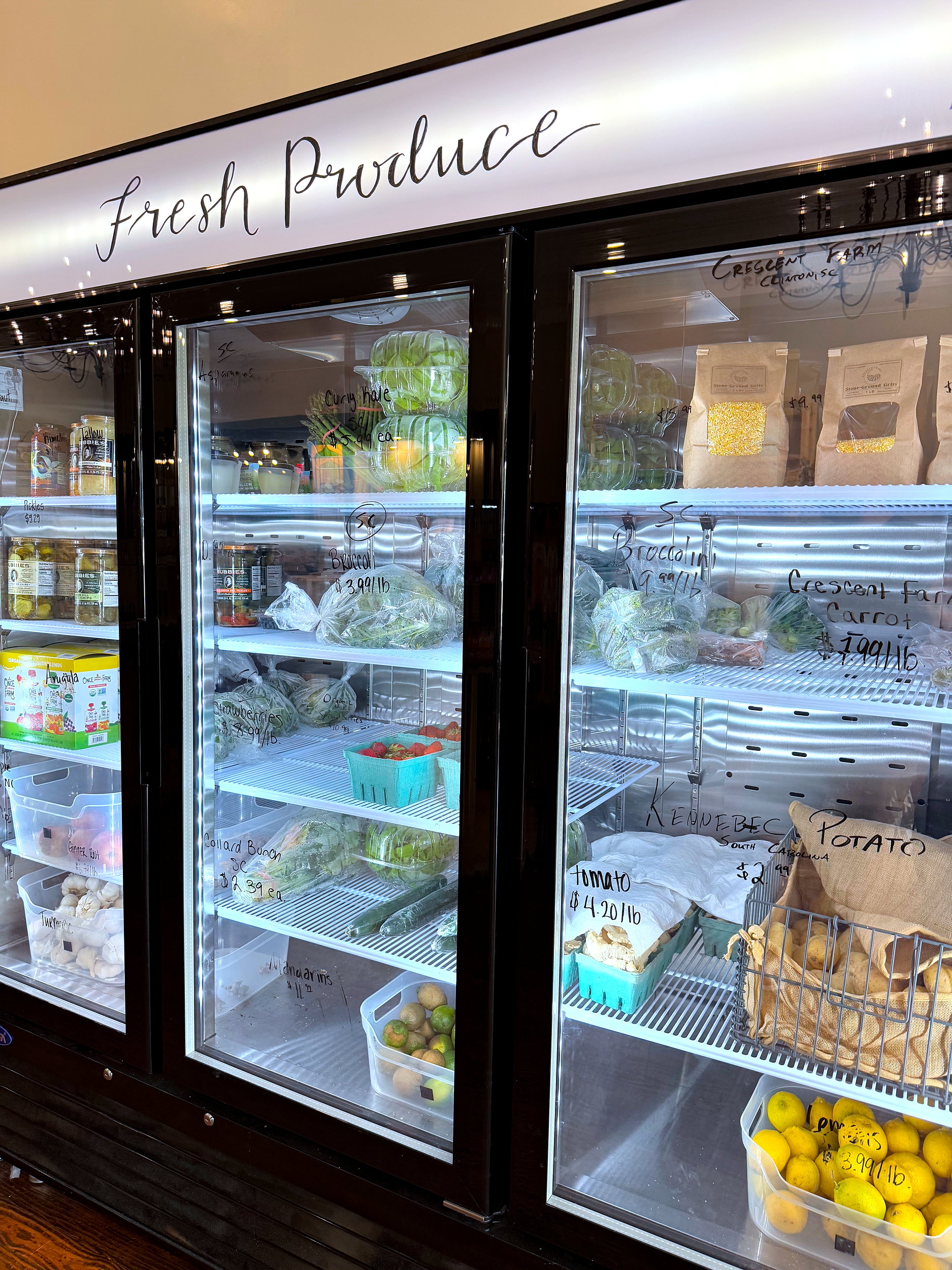 A cooler with fresh produce at the Sanitary Market in Laurens