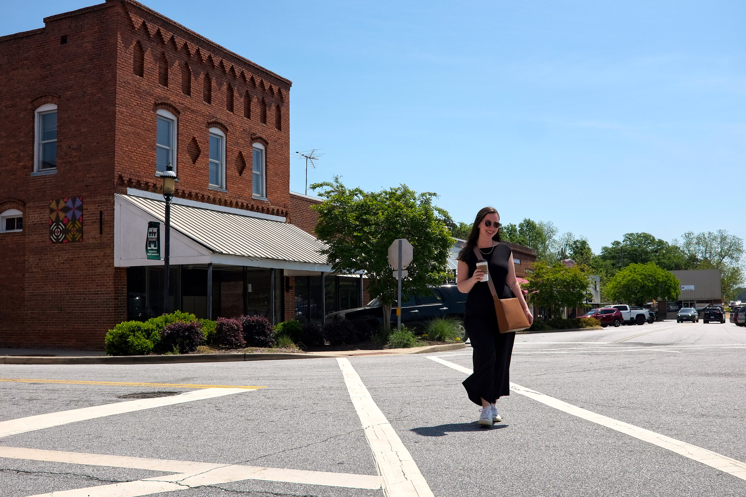 Alyssa walks down a street in McCormick