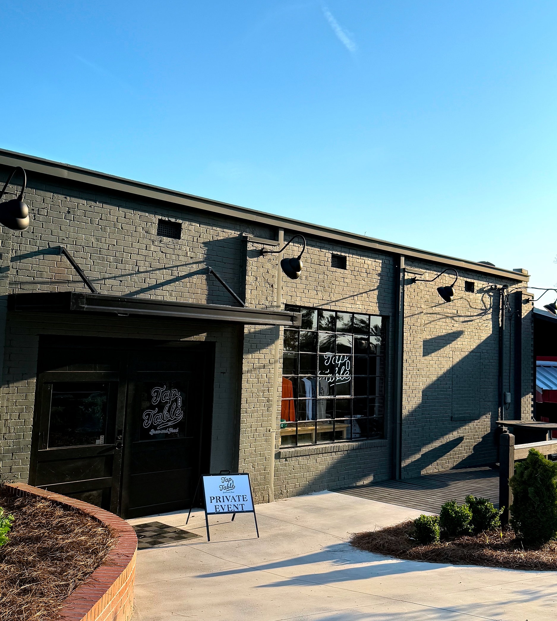 Exterior of Tap & Table with a sign indicating it is closed for a private event