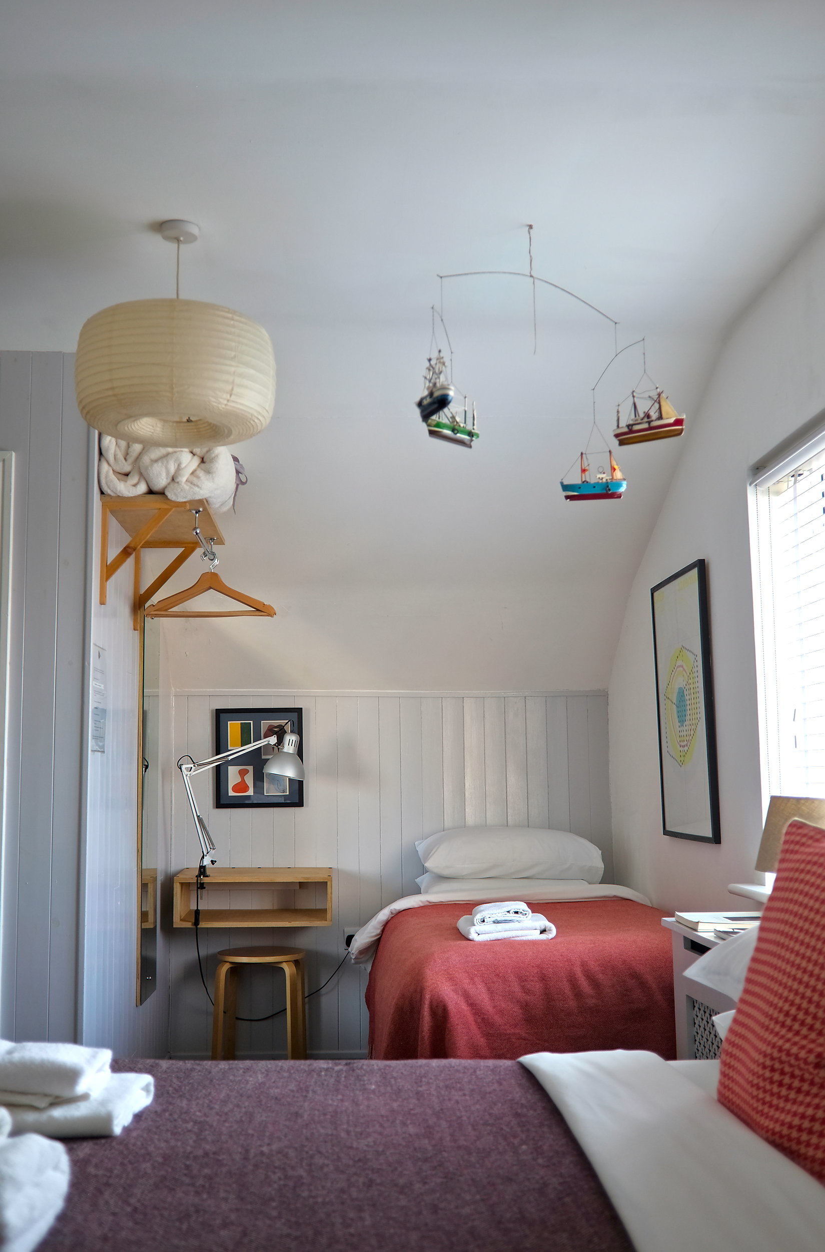 The Family Room at The Stop, and two of the three beds are visible
