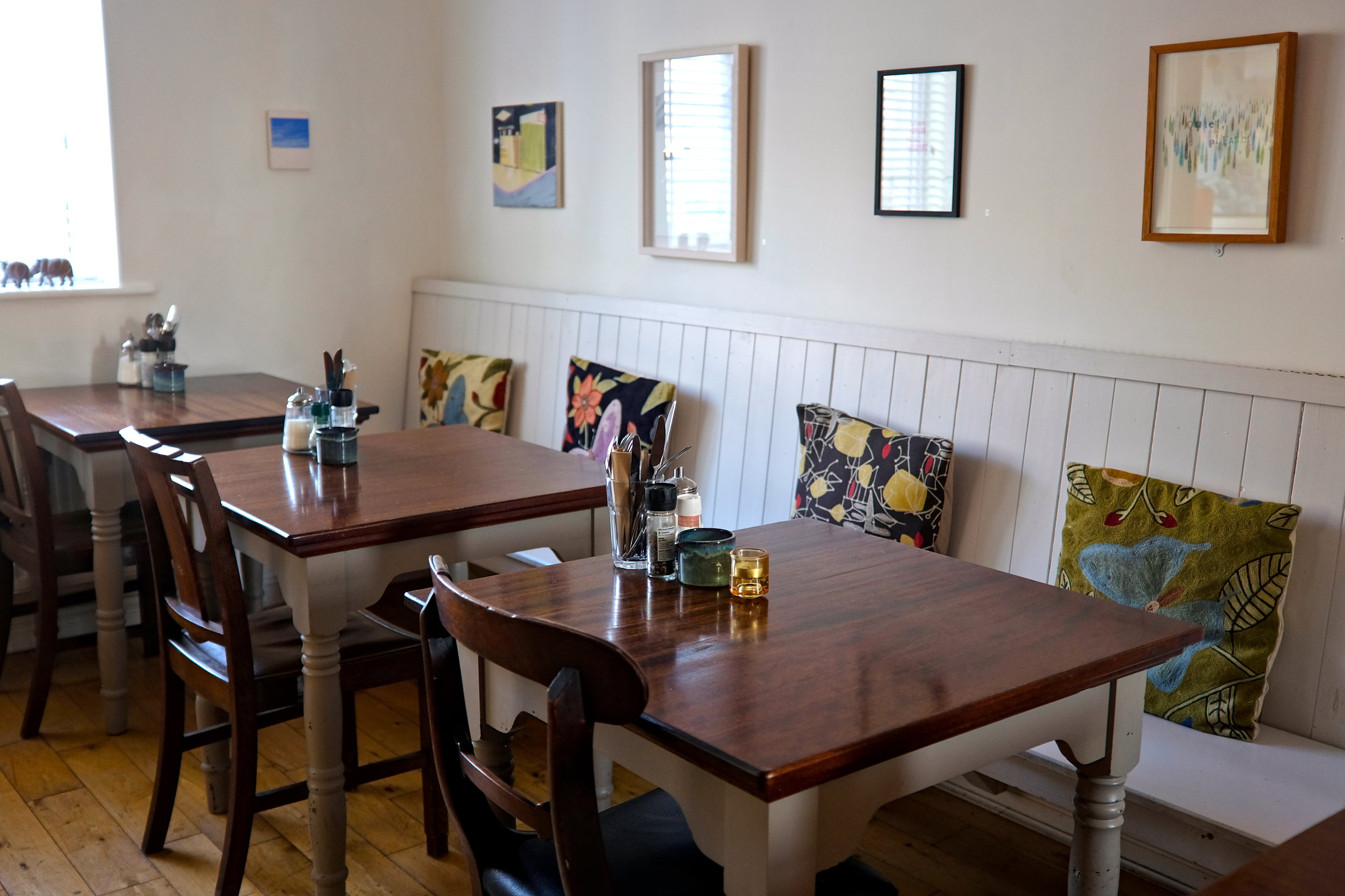 The charming, art-filled breakfast room at The Stop