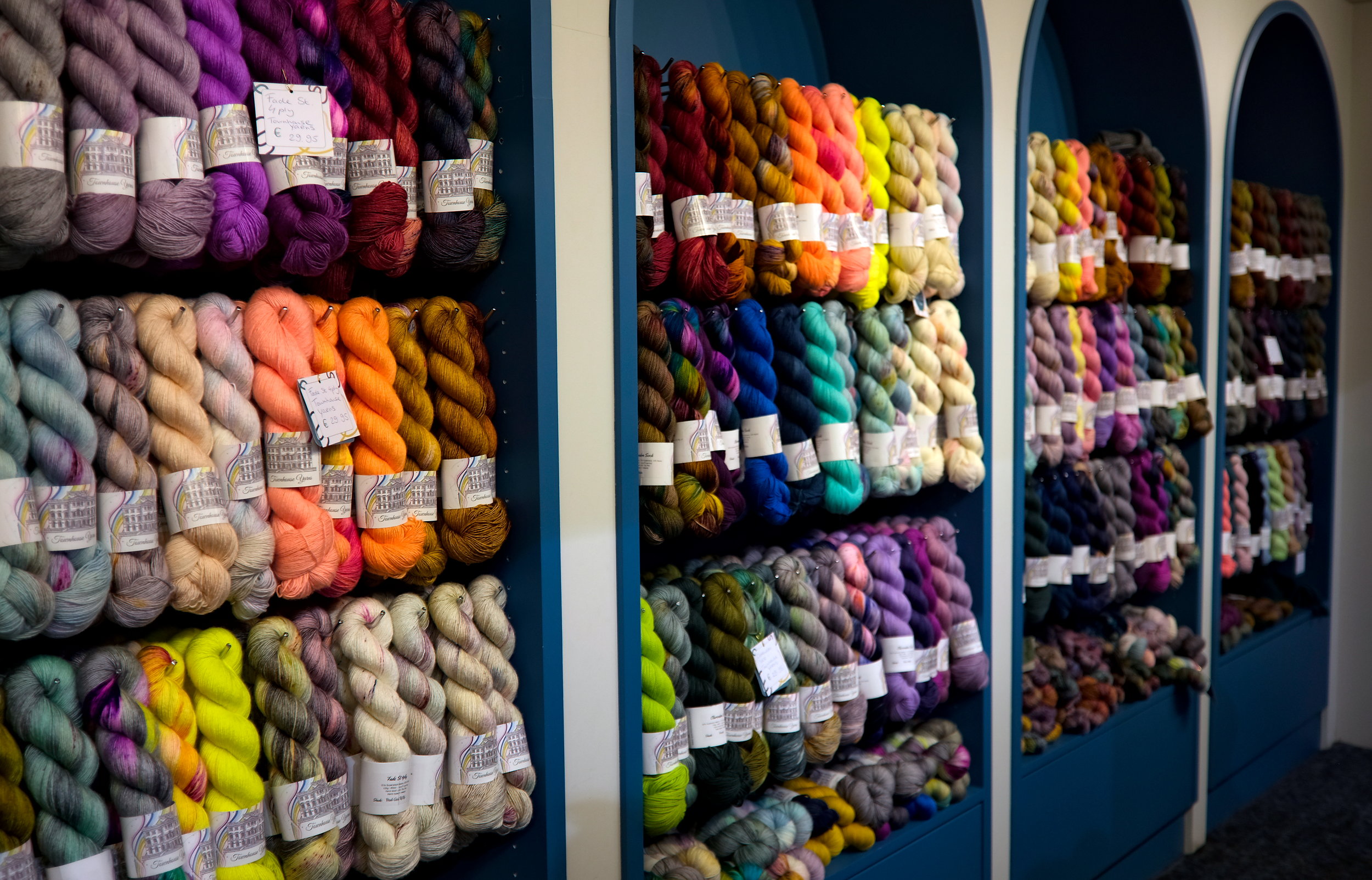 A vibrant display of yarns on a wall at This is Knit in Dublin, Ireland