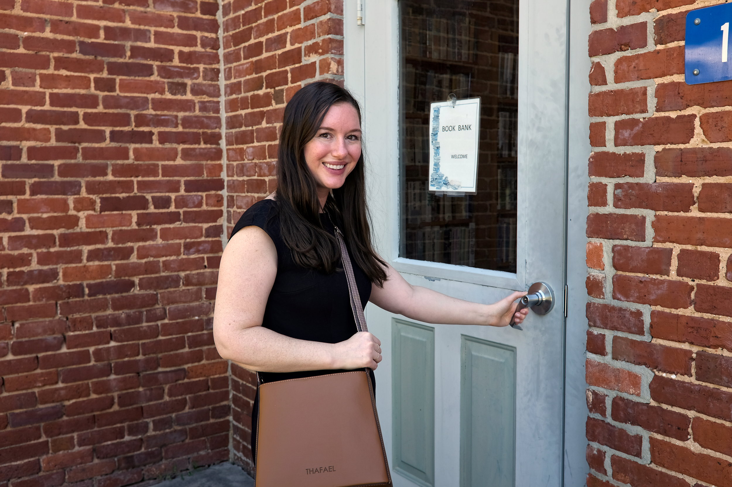 Alyssa opens a door at the Willington Bookshop