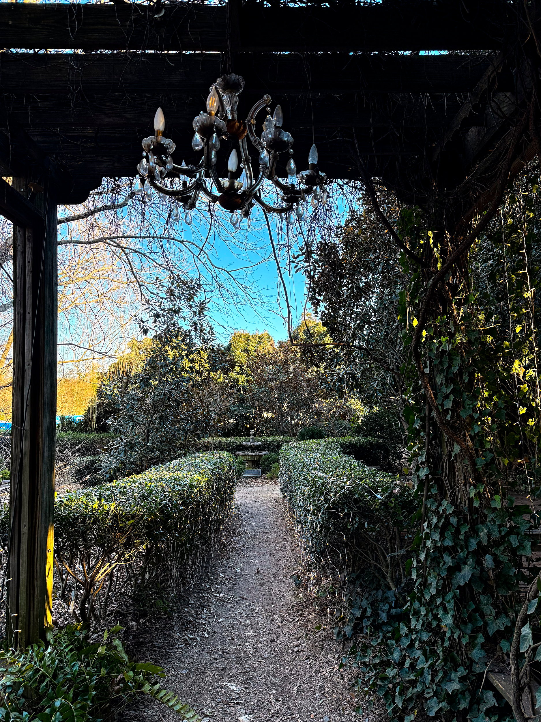 A chandelier in an archway at Rosie's Coffee & Wine Garden