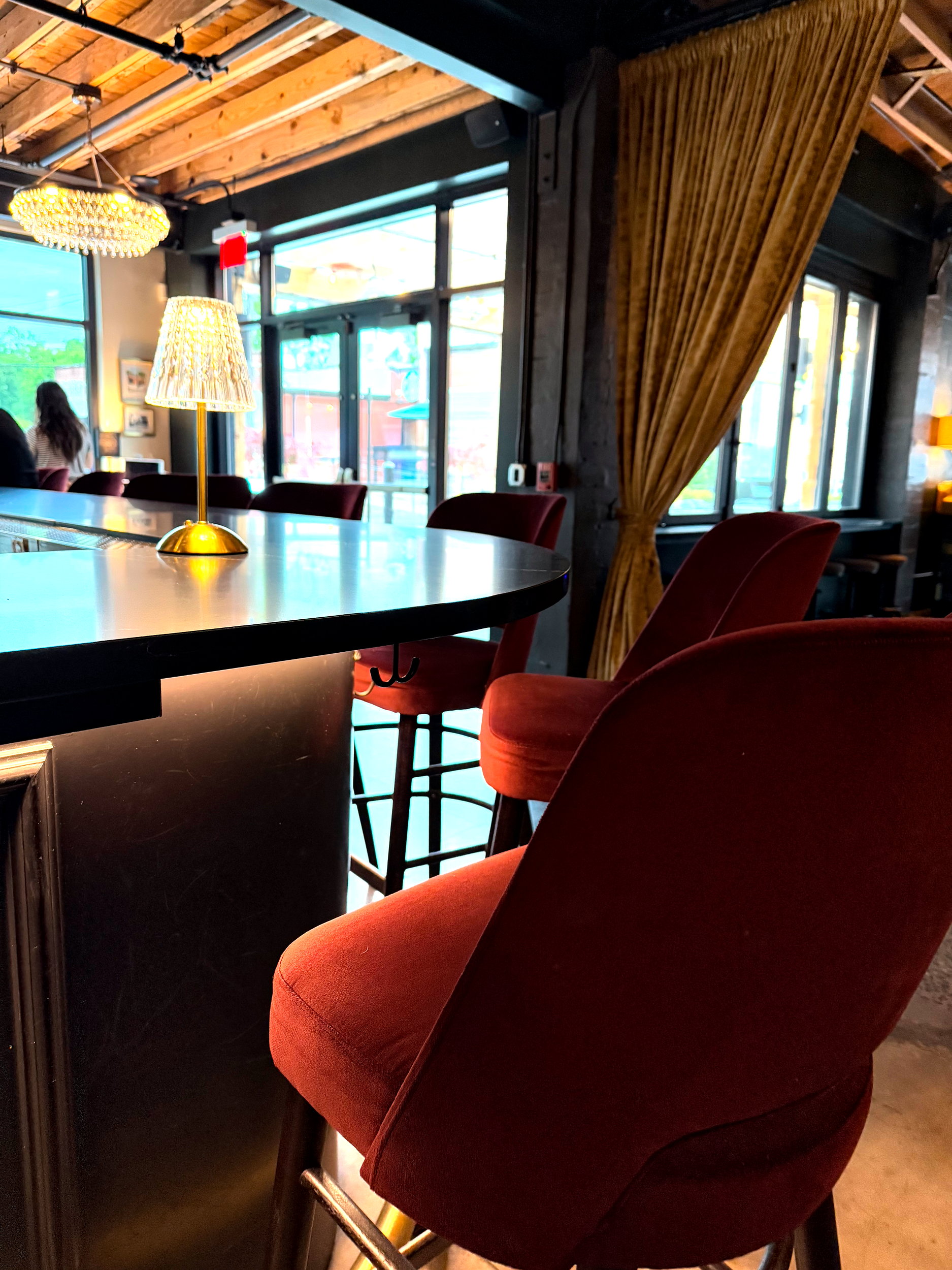 The bar with velvet seating at Flight Charlotte