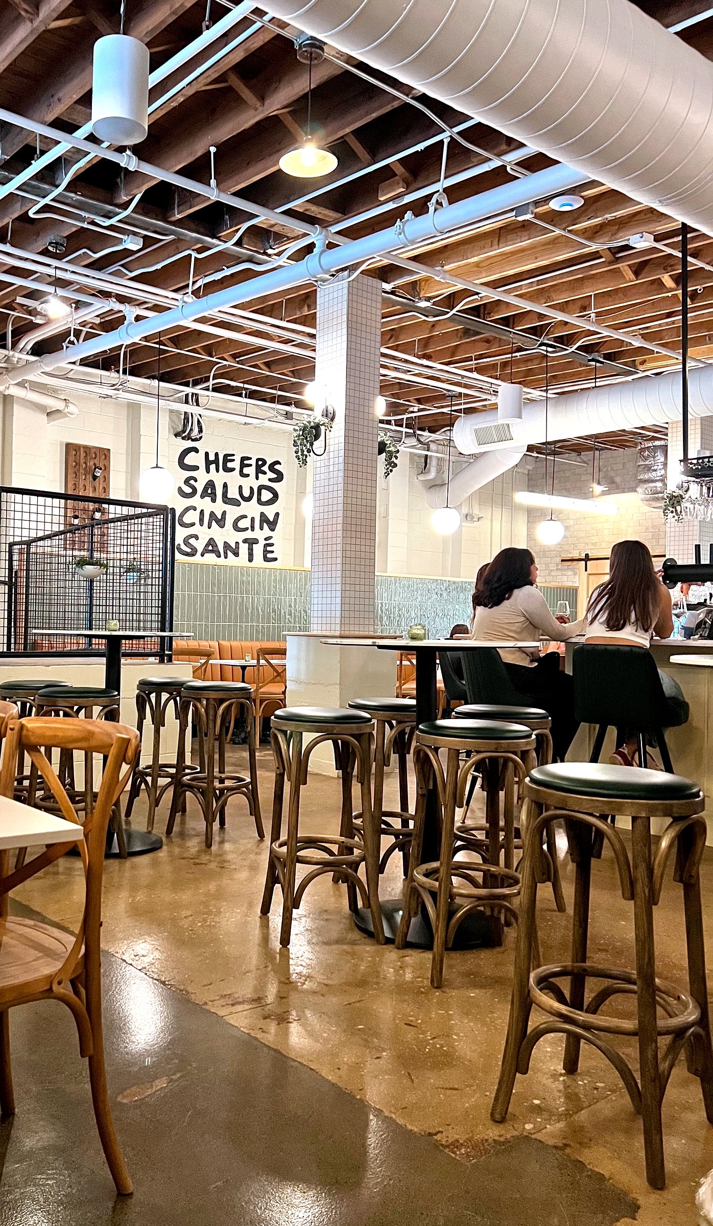 People sit at the bar at Frenchy's Sip and Shop