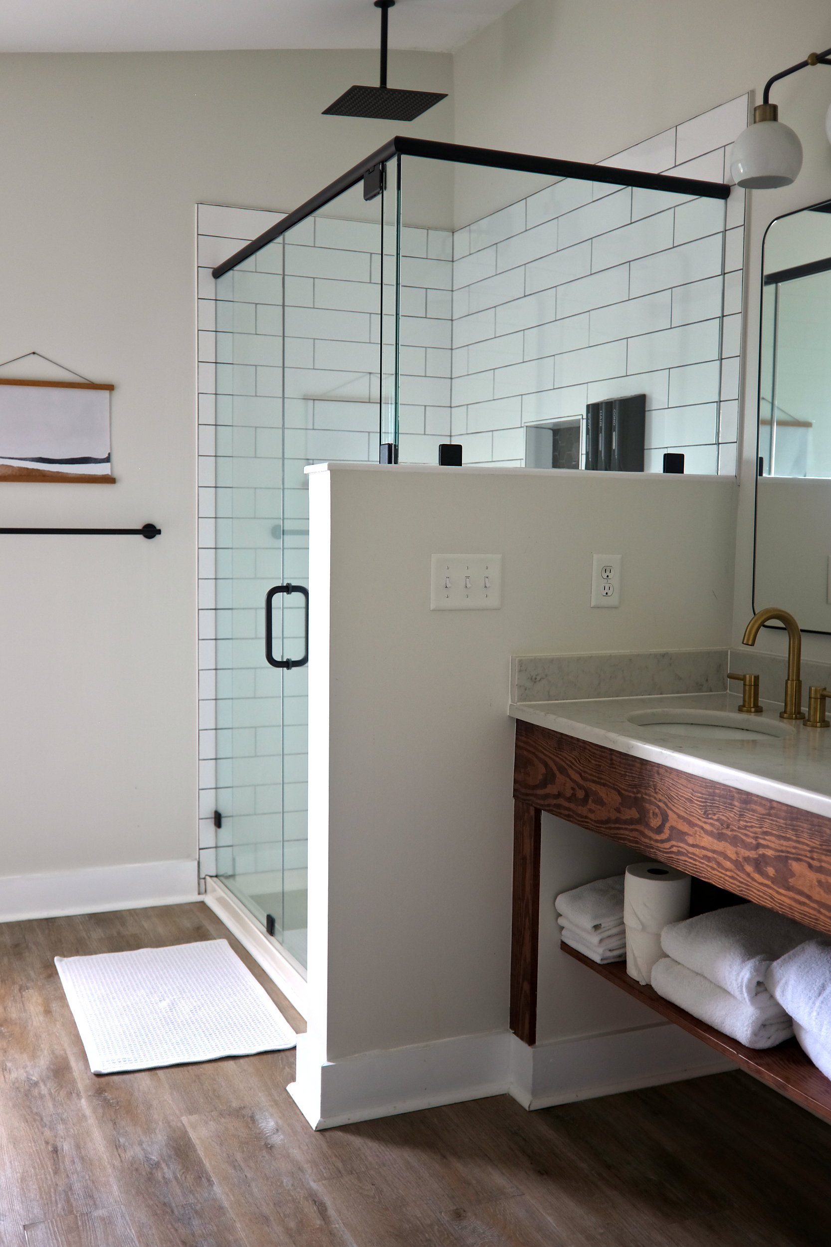 A bright, white bathroom at The Lighthouse Kure Beach