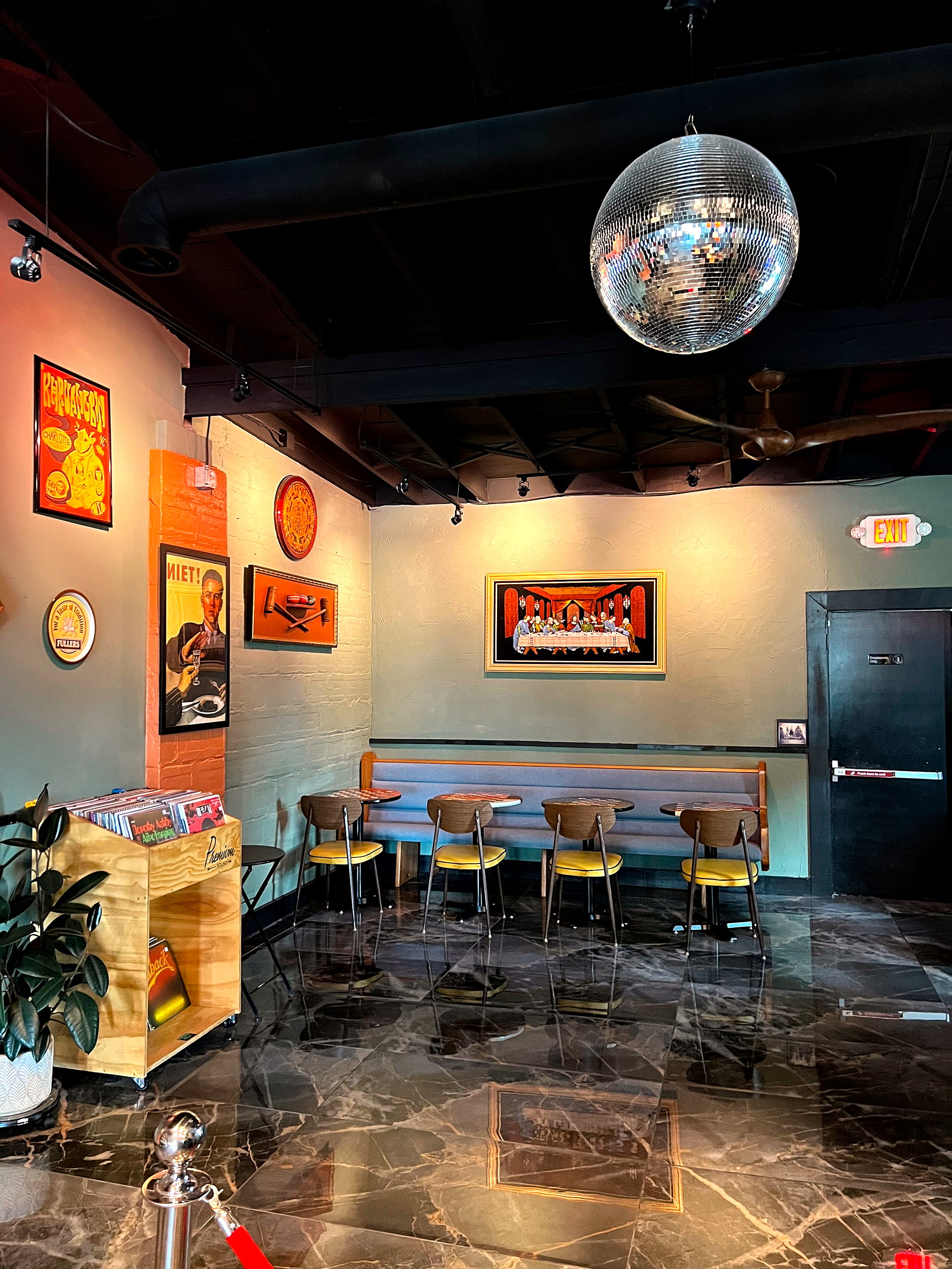 The seating area at Substrate, with a disco ball