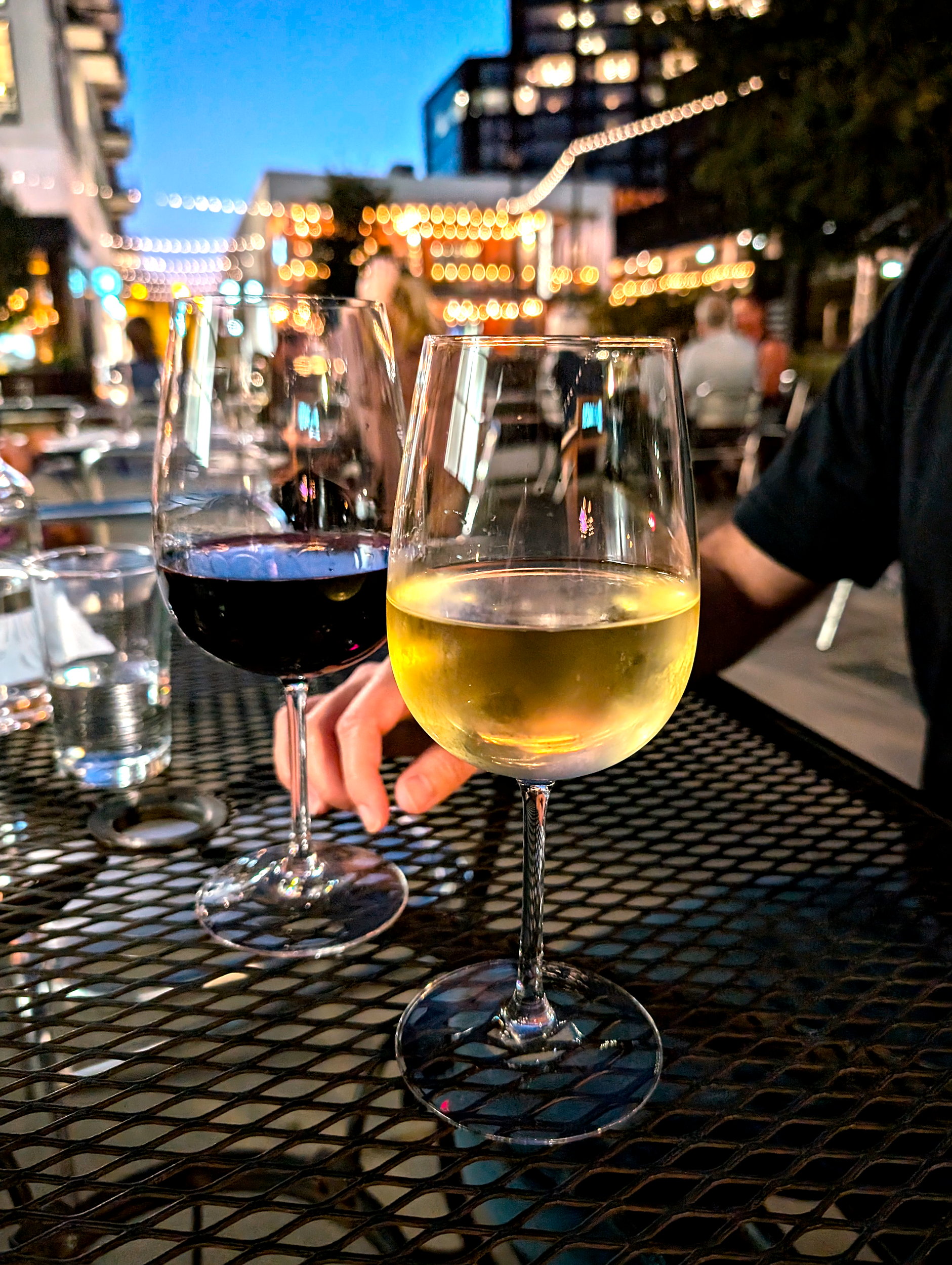Two glasses of wine at Vin Master on the patio in South End